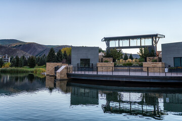 Avon, Colorado small mountain town at Nottingham park with view on lake in autumn fall sunrise morning by concert stage venue