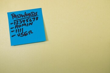 Password list on a blue sticky note