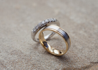 Wedding rings on a stone background