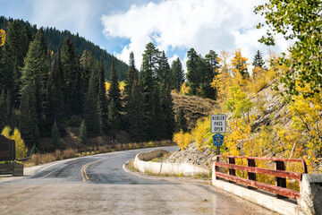 Crested Butte Kebler Pass mountain view and road with cloudy sky in fall autumn foliage