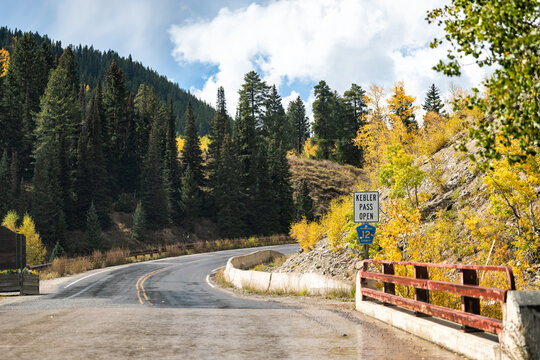 Crested Butte Kebler Pass mountain view and road with cloudy sky in fall autumn foliage