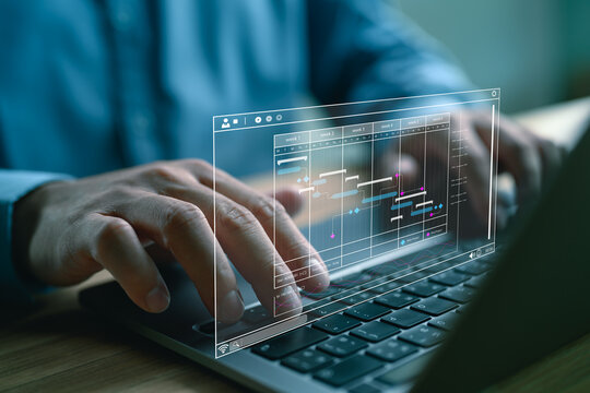 Project manager working with Gantt chart schedule to plan tasks and deliverables. Scheduling activities with a planning software, Corporate strategy for finance, operations, sales, marketing.