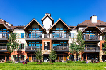 Vail Colorado lodge hotel condo building of European Swiss style ski resort town, apartment building with balcony in summer