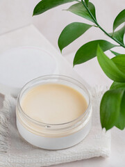 Mockup of an open jar of body cream. Cosmetology products Blank label. Place for inscription and logo. top view.