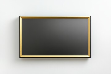 A blank black frame with a gold border is hung on a white wall.