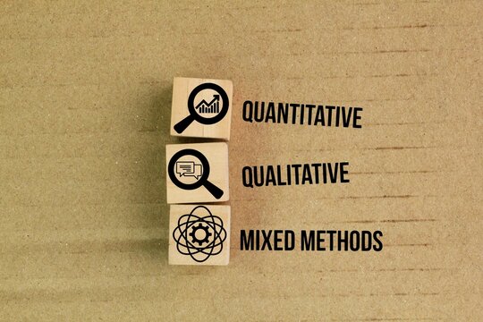 wooden cube with three icons These three research approaches are quantitative, qualitative, and mixed methods