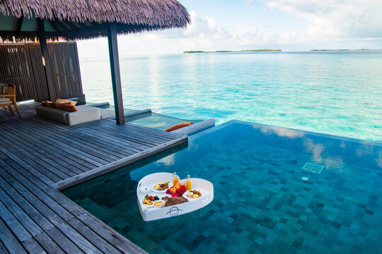 Floating breakfast in a heart shape in the pool in Maldives