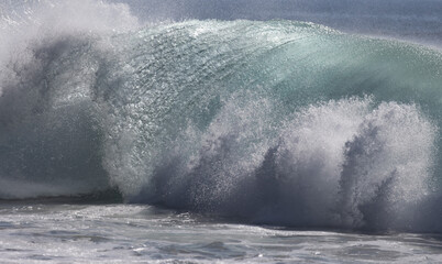 Storm wave breaking on shore