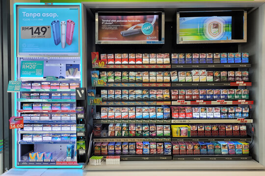 Penang, Malaysia - Oct 26, 2024: Tobacco product and vape display in a FamilyMart convenience store featuring cigarettes and electronic smoking devices