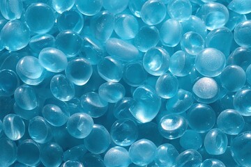 Close-up of a large number of bright blue glass beads.