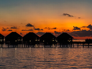 Sunset views from overwater pool villa in Maldives