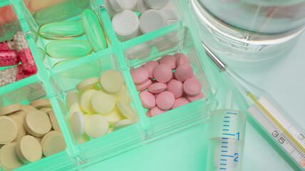 medical background with pills and thermometer