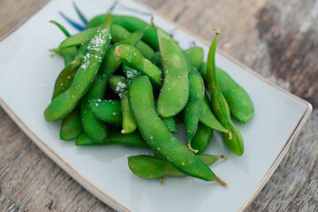 Organic boiled green Edamame beans with sea salt