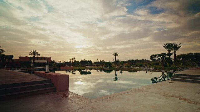 Panoramic view of the exteriors of the Fairmont Royal Palm resort in Marrakesh at sunrise. Luxury hotel. Refined Exterior design. View of the outdoor swimming pools.