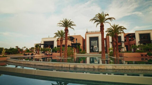 Panoramic view of the exteriors of the Fairmont Royal Palm resort in Marrakesh. Luxury hotel. Refined Exterior design. View of the outdoor swimming pools.