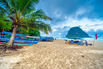 Beautiful tropical beach on Red Island (Pulau Merah) coast