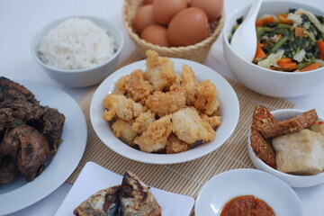 traditional Indonesian food arranged neatly on a white surface