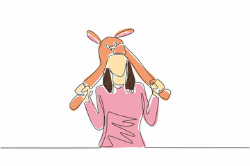 One single line drawing of young cute beauty girl wearing funny adorable rabbit animal character hat. Cap from quality fluffy fabric material. National Hat Day