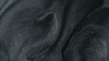 Sparkling particles drops. Sand structure. Gel flows. White black silver color sparkling flakes texture paint fluid abstract modern art background.