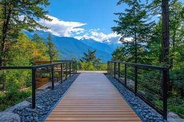 Obraz premium Wooden boardwalk leading to breathtaking mountain view in summer