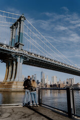 Enjoy a delightful stroll beneath the Manhattan Bridge with views of New York