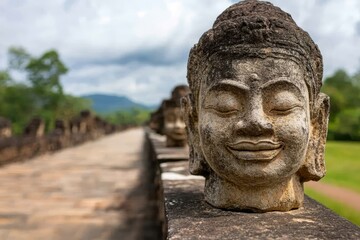 Obraz premium A stone buddha head on the side of a stone wall