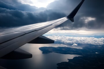 Obraz premium A view of the wing of an airplane flying above the clouds