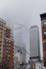 Fototapeta premium Foggy Cityscape Blend Where the Urban Jungle Meets Misty Skyline Inviting Wonder