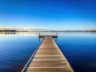 Fototapeta premium Minimalist Serenity at Perth's Swan River Jetty: A Tranquil View of Nature's Beauty
