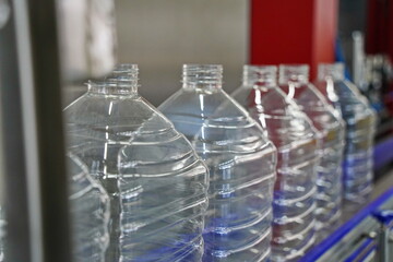 Plastic bottles on a conveyor belt at the factory.