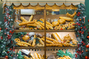 A case of bread and pretzels adorned for Christmas
