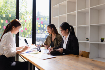 Asian businesswoman teamwork working on laptop with finances analysis report at desk in office, business financing, accounting banking, Team of creative and business planning, 