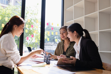 Asian businesswoman teamwork working on laptop with finances analysis report at desk in office, business financing, accounting banking, Team of creative and business planning, 