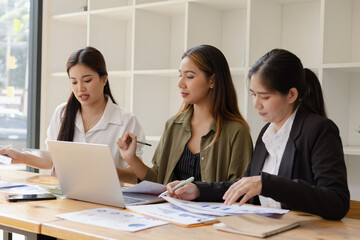 Asian businesswoman teamwork working on laptop with finances analysis report at desk in office, business financing, accounting banking, Team of creative and business planning, 