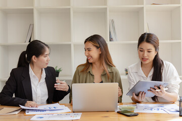 Asian businesswoman teamwork working on laptop with finances analysis report at desk in office, business financing, accounting banking, Team of creative and business planning, 