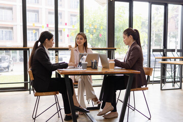 Asian businesswoman teamwork working on laptop with finances analysis report at desk in office, business financing, accounting banking, Team of creative and business planning, 