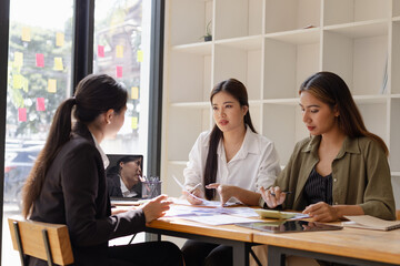 Asian businesswoman teamwork working on laptop with finances analysis report at desk in office, business financing, accounting banking, Team of creative and business planning, 