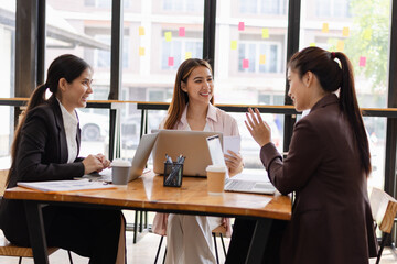 Asian businesswoman teamwork working on laptop with finances analysis report at desk in office, business financing, accounting banking, Team of creative and business planning, 