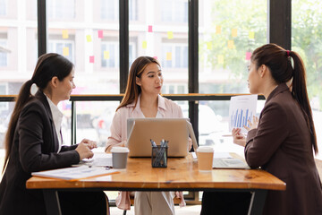 Asian businesswoman teamwork working on laptop with finances analysis report at desk in office, business financing, accounting banking, Team of creative and business planning, 