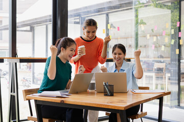 Excited Asian businesswoman team working together in office, About successful startup projects concept.
