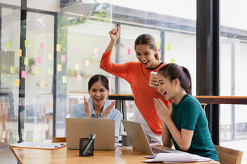 Excited Asian businesswoman team working together in office, About successful startup projects concept.