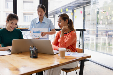 Technology and financial advisory services concept. Businesswoman teamwork and working on digital laptop computer with advisor showing plan of investment to clients at table office. Digital marketing.