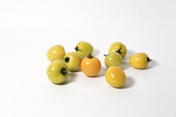 Little green tomatoes on isolated white background