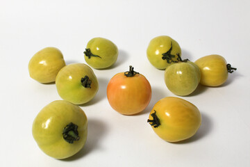 Little green tomatoes on isolated white background