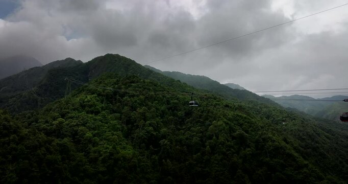 Aerial view of famous Fansipan Sun World cable car gondolas going up and down