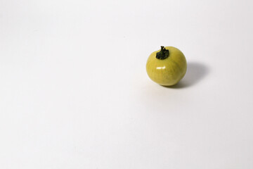 Little green tomatoes on isolated white background
