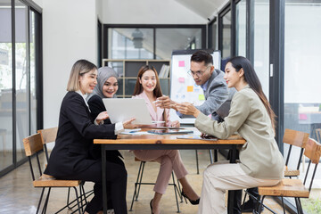 Team of Asian business people and working together in office, Startup projects and business presentation at meeting room.