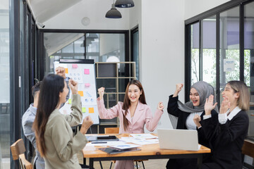Team of Asian business people and working together in office, Startup projects and business presentation at meeting room.