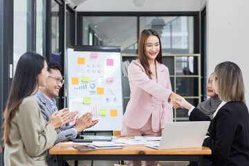 Team of Asian business people and working together in office, Startup projects and business presentation at meeting room.