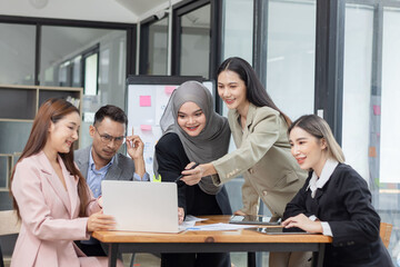 Fototapeta premium Team of Asian business people and working together in office, Startup projects and business presentation at meeting room.